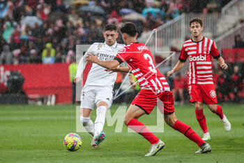 2023-04-25 - Federico Valverde of Real Madrid and Miguel Gutierrez of Girona during the Spanish championship La Liga football match between Girona FC and Real Madrid on April 25, 2023 at Montilivi stadium in Girona, Spain - FOOTBALL - SPANISH CHAMP - GIRONA V REAL MADRID - SPANISH LA LIGA - SOCCER