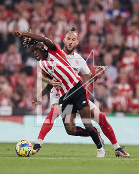 2023-04-27 - Nemanja Gudelj of Sevilla FC competes for the ball with Nico Williams of Athletic Club during the Spanish championship La Liga football match between Athletic Club and Sevilla FC on April 27, 2023 at San Mames stadium in Bilbao, Spain - FOOTBALL - SPANISH CHAMP - ATHLETIC CLUB V SEVILLA FC - SPANISH LA LIGA - SOCCER