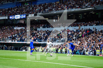 2023-05-13 - Vinícius Júnior (Real Madrid) in action against Fabrizio Angileri (Getafe) and Portu (Getafe) during the football match between
Real Madrid and Getafe
valid for the match day 34 of the Spanish first division league “La Liga” celebrated in Madrid, Spain at Bernabeu stadium on Saturday 13 May 2023 - REAL MADRID VS GETAFE - SPANISH LA LIGA - SOCCER