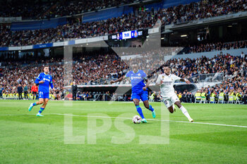 2023-05-13 - Vinícius Júnior (Real Madrid) in action against Djené Dakonam (Getafe) during the football match between
Real Madrid and Getafe
valid for the match day 34 of the Spanish first division league “La Liga” celebrated in Madrid, Spain at Bernabeu stadium on Saturday 13 May 2023 - REAL MADRID VS GETAFE - SPANISH LA LIGA - SOCCER