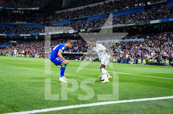 2023-05-13 - Vinícius Júnior (Real Madrid) in action against Fabrizio Angileri (Getafe) during the football match between
Real Madrid and Getafe
valid for the match day 34 of the Spanish first division league “La Liga” celebrated in Madrid, Spain at Bernabeu stadium on Saturday 13 May 2023 - REAL MADRID VS GETAFE - SPANISH LA LIGA - SOCCER