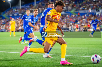 2023-08-13 - Lamine Yamal (Barcelona) against Juan Iglesias (Getafe) during the LaLiga EA Sports football match between Getafe and Barcelona played at Coliseum Alfonso Perez Stadium on August 13, 2023 in Getafe, Spain - GETAFE VS BARCELONA - SPANISH LA LIGA - SOCCER