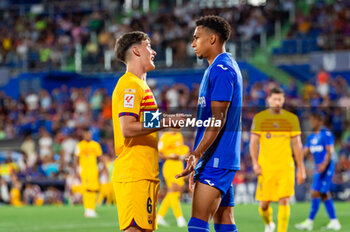 2023-08-13 - Gaston Alvarez (Getafe) and Gavi (Barcelona) after the controversial play with the alleged penalty not whistled by the referee at the end of the LaLiga EA Sports football match between Getafe and Barcelona played at Coliseum Alfonso Perez Stadium on August 13, 2023 in Getafe, Spain - GETAFE VS BARCELONA - SPANISH LA LIGA - SOCCER