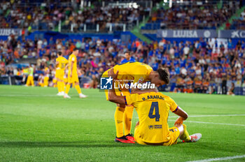 2023-08-13 - Gavi (Barcelona) and Ronald Araujo (Barcelona) after the controversial play with the alleged penalty not whistled by the referee at the end of the LaLiga EA Sports football match between Getafe and Barcelona played at Coliseum Alfonso Perez Stadium on August 13, 2023 in Getafe, Spain - GETAFE VS BARCELONA - SPANISH LA LIGA - SOCCER