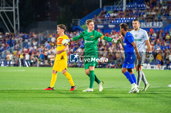 2023-08-13 - Gavi (Barcelona), Marc-Andre Ter Stegen (Barcelona), Damian Suarez (Getafe), David Soria (Getafe) after the controversial play with the alleged penalty not whistled by the referee at the end of the LaLiga EA Sports football match between Getafe and Barcelona played at Coliseum Alfonso Perez Stadium on August 13, 2023 in Getafe, Spain - GETAFE VS BARCELONA - SPANISH LA LIGA - SOCCER