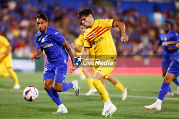 2023-08-13 - Abde Ezzalzouli of FC Barcelona and Damian Suarez of Getafe during the Spanish championship La Liga football match between Getafe CF and FC Barcelona on August 13, 2023 at Coliseum Alfonso Perez stadium in Getafe, Madrid, Spain - FOOTBALL - SPANISH CHAMP - GETAFE V FC BARCELONA - SPANISH LA LIGA - SOCCER