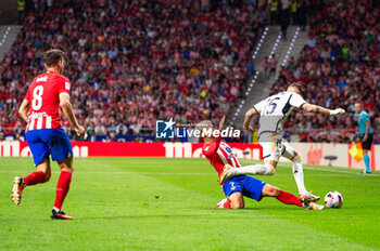 2023-09-24 - Antoine Griezmann (Atletico Madrid) in action against Federico Valverde (Real Madrid), with Saul Niguez (Atletico Madrid) on the left, during the football match between Atletico Madrid vs Real Madrid, knows as the Derbi of Madrid, valid for the matchday 06 of LaLiga EA Sports played at Estadio Civitas Metropolitano on September 24, 2023 in Madrid, Spain - ATLETICO MADRID VS REAL MADRID - SPANISH LA LIGA - SOCCER