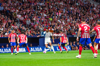 2023-09-24 - Jude Bellingham (Real Madrid) in action against Jorge Resurreccion Merodio (Koke) and Mario Hermoso (Atletico Madrid) during the football match between Atletico Madrid vs Real Madrid, knows as the Derbi of Madrid, valid for the matchday 06 of LaLiga EA Sports played at Estadio Civitas Metropolitano on September 24, 2023 in Madrid, Spain - ATLETICO MADRID VS REAL MADRID - SPANISH LA LIGA - SOCCER