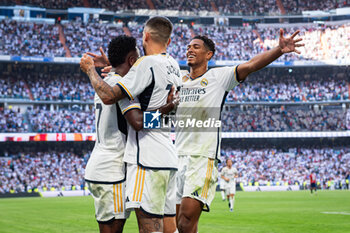 2023-10-07 - Jose Luis Sanmartin Mato (Joselu) (Real Madrid) celebrate his goal with Vinicius Junior (Real Madrid) and Jude Bellingham (Real Madrid) during the football match of Spanish championship La Liga EA Sports between Real Madrid vs Osasuna played at Bernabeu stadium on October 07, 2023 in Madrid, Spain - REAL MADRID VS OSASUNA - SPANISH LA LIGA - SOCCER