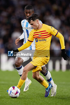2023-11-04 - Pedri Gonzalez of FC Barcelona competes for the ball with Mohamed-Ali Cho of Real Sociedad during the Spanish championship La Liga football match between Real Sociedad and FC Barcelona on November 4, 2023 at Reale Arena in San Sebastian, Spain - FOOTBALL - SPANISH CHAMP - REAL SOCIEDAD V FC BARCELONA - SPANISH LA LIGA - SOCCER