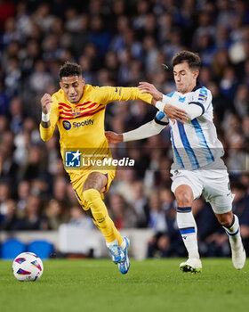 2023-11-04 - Raphinha of FC Barcelona and Martin Zubimendi of Real Sociedad during the Spanish championship La Liga football match between Real Sociedad and FC Barcelona on November 4, 2023 at Reale Arena in San Sebastian, Spain - FOOTBALL - SPANISH CHAMP - REAL SOCIEDAD V FC BARCELONA - SPANISH LA LIGA - SOCCER