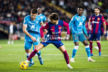 2023-12-20 - Joao Felix of FC Barcelona in action against Cesar Montes of UD Almeria during the Spanish championship La Liga football match between FC Barcelona and UD Almeria on December 20, 2023 at Estadio Olimpico de Montjuic in Barcelona, Spain - FOOTBALL - SPANISH CHAMP - BARCELONA V ALMERIA - SPANISH LA LIGA - SOCCER