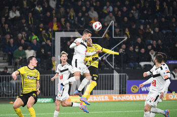 2023-02-18 - February 18, 2023, Bern, Wankdorf, Super League: BSC Young Boys - FC Lugano, #14 Jonathan Sabbatini (Lugano) in a header duel with #16 Christian Fassnacht (Young Boys). - SUPER LEAGUE: BSC YOUNG BOYS - FC LUGANO - SWISS SUPER LEAGUE - SOCCER