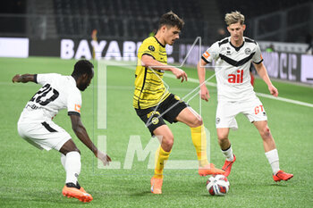 2023-02-18 - February 18, 2023, Bern, Wankdorf, Super League: BSC Young Boys - FC Lugano, #22 Donat Rrudhani (Young Boys) in a duel with #77 Roman Macek (Lugano) and #20 Ousmane Doumbia (Lugano). - SUPER LEAGUE: BSC YOUNG BOYS - FC LUGANO - SWISS SUPER LEAGUE - SOCCER