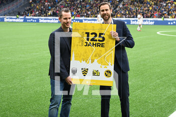 2023-03-19 - February 19, 2023, Bern, Wankdorf, Super League: BSC Young Boys - FC Lugano, Claudius Schafer (CEO Swiss Football League) presents Wanja Greuel (CEO BSC Young Boys) with an anniversary present. - SUPER LEAGUE: BSC YOUNG BOYS - FC LUGANO - SWISS SUPER LEAGUE - SOCCER