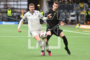 2023-03-19 - February 18, 2023, Bern, Wankdorf, Super League: BSC Young Boys - FC Lugano, #30 Sandro Lauper (Young Boys) against #19 Darian Males (Basel). - SUPER LEAGUE: BSC YOUNG BOYS - FC LUGANO - SWISS SUPER LEAGUE - SOCCER