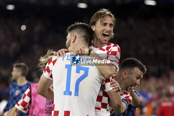2023-06-14 - Luka Modric of Croatia celebrates a goal with Bruno Petkovic, Ivan Perisic - a goal ultimately cancelled - during the UEFA Nations League, Semi-finals football match between Netherlands and Croatia on June 14, 2023 at Stadion Feijenoord 'De Kuip' in Rotterdam, Netherlands - FOOTBALL - UEFA NATIONS LEAGUE 2023 - 1/2 - NETHERLANDS V CROATIA - UEFA NATIONS LEAGUE - SOCCER