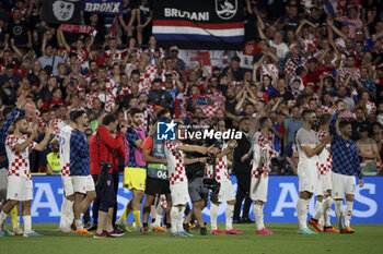 2023-06-14 - Luka Modric of Croatia and teammates celebrate the victory with their fans following the UEFA Nations League, Semi-finals football match between Netherlands and Croatia on June 14, 2023 at Stadion Feijenoord 'De Kuip' in Rotterdam, Netherlands - FOOTBALL - UEFA NATIONS LEAGUE 2023 - 1/2 - NETHERLANDS V CROATIA - UEFA NATIONS LEAGUE - SOCCER