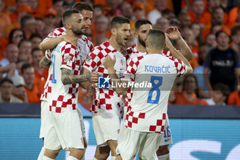 2023-06-14 - Andrej Kramaric of Croatia celebrates his goal with teammates during the UEFA Nations League, Semi-finals football match between Netherlands and Croatia on June 14, 2023 at Stadion Feijenoord 'De Kuip' in Rotterdam, Netherlands - FOOTBALL - UEFA NATIONS LEAGUE 2023 - 1/2 - NETHERLANDS V CROATIA - UEFA NATIONS LEAGUE - SOCCER