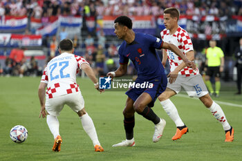 2023-06-14 - Cody Gakpo of Netherlands, Mario Pasalic of Croatia during the UEFA Nations League, Semi-finals football match between Netherlands and Croatia on June 14, 2023 at Stadion Feijenoord 'De Kuip' in Rotterdam, Netherlands - FOOTBALL - UEFA NATIONS LEAGUE 2023 - 1/2 - NETHERLANDS V CROATIA - UEFA NATIONS LEAGUE - SOCCER