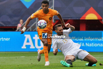 2023-06-18 - Cody Gakpo (Netherlands) and Rafael Toloi (Italy) - THIRD-PLACE MATCH - NETHERLANDS VS ITALY - UEFA NATIONS LEAGUE - SOCCER