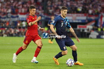 2023-06-18 - Andrej Kramaric of Croatia, Yeremy Pino of Spain (left) during the UEFA Nations League 2023, Final football match between Croatia and Spain on June 18, 2023 at Stadion Feijenoord 'De Kuip' in Rotterdam, Netherlands - FOOTBALL - UEFA NATIONS LEAGUE 2023 - FINAL - CROATIA V SPAIN - UEFA NATIONS LEAGUE - SOCCER