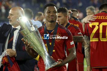 2023-06-18 - Ansu Fati of Spain celebrates the victory with the trophy following the UEFA Nations League 2023 Final football match between Croatia and Spain on June 18, 2023 at Stadion Feijenoord 'De Kuip' in Rotterdam, Netherlands - FOOTBALL - UEFA NATIONS LEAGUE 2023 - FINAL - CROATIA V SPAIN - UEFA NATIONS LEAGUE - SOCCER