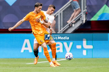 2023-06-18 - Wout Weghorst of The Netherlands, Alessandro Buongiorno of Italy during the UEFA Nations League 2023, Third-place match between Netherlands and Italy on June 18, 2023 at De Grolsch Veste, FC Twente stadium in Enschede, Netherlands - FOOTBALL - UEFA NATIONS LEAGUE 2023 - 3RD PLACE - NETHERLANDS V ITALY - UEFA NATIONS LEAGUE - SOCCER