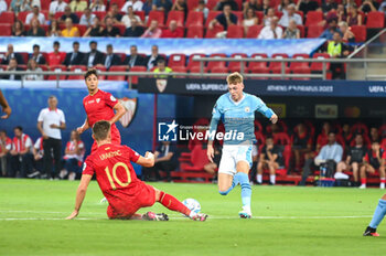 2023-08-16 - 80 COLE PALMER of Manchester City competing with 10 IVAN RAKITIC of Sevilla FC during the UEFA Super Cup match between Manchester City and Sevilla FC at Georgios Karaiskakis
 Stadium on August 16, 2023, in Piraeus, Greece. - UEFA SUPER CUP MANCHESTER CITY VS SEVILLA FC - UEFA SUPER CUP - SOCCER
