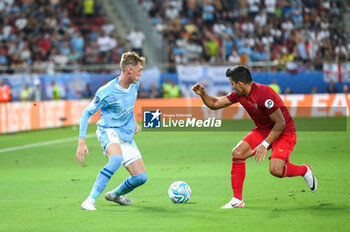 2023-08-16 - 80 COLE PALMER of Manchester City competing with 19 ACUNA of Sevilla FC during the UEFA Super Cup match between Manchester City and Sevilla FC at Georgios Karaiskakis
 Stadium on August 16, 2023, in Piraeus, Greece. - UEFA SUPER CUP MANCHESTER CITY VS SEVILLA FC - UEFA SUPER CUP - SOCCER