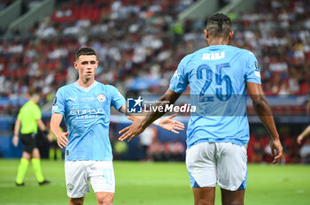16/08/2023 - 47 PHIL FODEN with 25 MANUEL AKANJI of Manchester City during the UEFA Super Cup 
match between Manchester City and Sevilla FC at Georgios Karaiskakis
 Stadium on August 16, 2023, in Piraeus, Greece. - UEFA SUPER CUP MANCHESTER CITY VS SEVILLA FC - SUPERCOPPA EUROPEA - CALCIO
