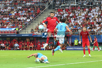 16/08/2023 - 15 EN-NESYRI of Sevilla FC competing with 6 NATHAN AKE of Manchester City during the UEFA Super Cup match between Manchester City and Sevilla FC at Georgios Karaiskakis Stadium on August 16, 2023, in Piraeus, Greece. - UEFA SUPER CUP MANCHESTER CITY VS SEVILLA FC - SUPERCOPPA EUROPEA - CALCIO
