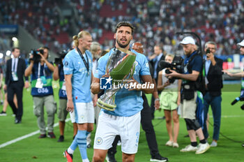 16/08/2023 - 3 RUBEN DIAS of Manchester City with the trophy after winning the UEFA Super Cup match between Manchester City and Sevilla FC at Georgios Karaiskakis Stadium on August 16, 2023, in Piraeus, Greece. - UEFA SUPER CUP MANCHESTER CITY VS SEVILLA FC - SUPERCOPPA EUROPEA - CALCIO