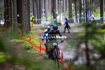 2023-05-14 - Joshua DUBAU of ROCKRIDER FORD RACING TEAM (FRA), Thomas PIDCOCK of INEOS GRENADIERS (GBR) during the 2023 UCI MTB World Cup, XCO cycling event on May 14, 2023 in Nove Mesto Na Morave, Czech Republic - CYCLING - MTB WORLD CUP 2023 - NOVE MESTO - MTB - MOUNTAIN BIKE - CYCLING