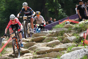 2023-07-02 - Puck Pieterse (NED) afterwards by\ Jolanda Neff (SUI) and Alessandra Keller (SUI) in action during XCO Elite Women race, at UCI MTB World Series 2023, Val di Sole stage on July 02, 2023 in Val di Sole, Trento, Italy. - UCI MTB WORLD CUP - XCO ELITE WOMEN RACE - MTB - MOUNTAIN BIKE - CYCLING