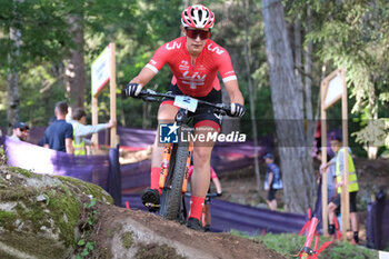 2023-07-02 - Ronja Blochlinger (SUI) in action during XCO U23 Women race, at UCI MTB World Series 2023, Val di Sole stage on July 02, 2023 in Val di Sole, Trento, Italy. - UCI MTB WORLD CUP - XCO U23 WOMEN RACE - MTB - MOUNTAIN BIKE - CYCLING