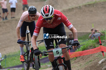 2023-07-02 - Luke Wiedmann (SUI) in action during XCO U23 Men race, at UCI MTB World Series 2023, Val di Sole stage on July 02, 2023 in Val di Sole, Trento, Italy. - UCI MTB WORLD CUP - XCO U23 MEN RACE - MTB - MOUNTAIN BIKE - CYCLING