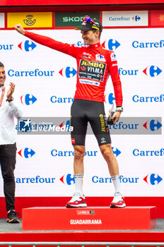 2023-09-16 - Sepp Kuss (Jumbo-Visma), red jersey and winner of the Vuelta Espana 2023, celebrates on the podium at the end of the stage 20 of the Spanish bicycle race La Vuelta on September 16, 2023 in Guadarrama, Spain - LA VUELTA - STAGE 20 - MANZANARES EL REAL - GUADARRAMA - SPANISH LA VUELTA - CYCLING