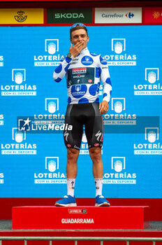 2023-09-16 - Remco Evenepoel (Soudal Quick-Step), climber jersey of the Vuelta Espana 2023, celebrates on the podium at the end of the stage 20 of the Spanish bicycle race La Vuelta on September 16, 2023 in Guadarrama, Spain - LA VUELTA - STAGE 20 - MANZANARES EL REAL - GUADARRAMA - SPANISH LA VUELTA - CYCLING