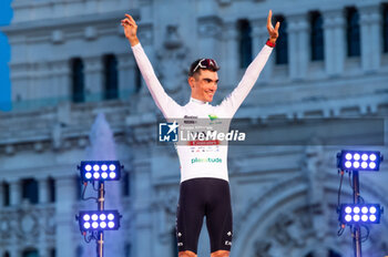 2023-09-17 - Juan Ayuso (UAE Emirates Team) is awarded with the withe jersey as the best youth cyclist of the Spanish bicycle race La Vuelta on the podium at Plaza de Cibeles on September 16, 2023 in Madrid, Spain - LA VUELTA FINAL AWARDS CEREMONY - SPANISH LA VUELTA - CYCLING