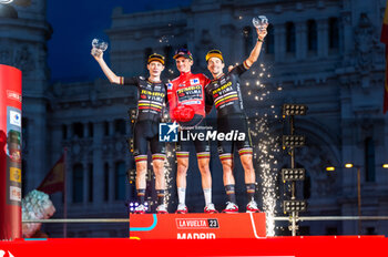 2023-09-17 - Jonas Vingegaard (Jumbo-Visma), Sepp Kuss (Jumbo-Visma) and Primoz Roglic (Jumbo-Visma) at the final awards ceremony of the Spanish cycling race La Vuelta at Plaza de Cibeles on September 16, 2023 in Madrid, Spain - LA VUELTA FINAL AWARDS CEREMONY - SPANISH LA VUELTA - CYCLING