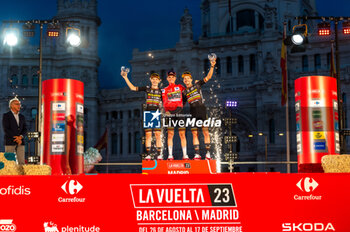 2023-09-17 - Jonas Vingegaard (Jumbo-Visma), Sepp Kuss (Jumbo-Visma) and Primoz Roglic (Jumbo-Visma) at the final awards ceremony of the Spanish cycling race La Vuelta at Plaza de Cibeles on September 16, 2023 in Madrid, Spain - LA VUELTA FINAL AWARDS CEREMONY - SPANISH LA VUELTA - CYCLING