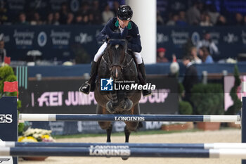 2023-11-11 - Denis Lynch (IRL) riding Dark Chocolate 48 in action during the CSI5* - International Competition N°5 presented by Crivelli - Verona Jumping at 125th Fieracavalli on November 11, 2023, Verona, Italy. - CSI5* - INTERNATIONAL COMPETITION N°5 - VERONA JUMPING - INTERNATIONALS - EQUESTRIAN