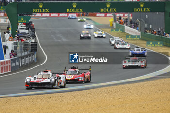 2023-06-10 - 07 CONWAY Mike (gbr), KOBAYASHI Kamui (jpn), LOPEZ José Maria (arg), Toyota Gazoo Racing, Toyota GR010 - Hybrid, and 51 PIER GUIDI Alessandro (ita), CALADO James (gbr), GIOVINAZZI Antonio (ita), Ferrari AF Corse, Ferrari 499P, start of the race, depart during the 24 Hours of Le Mans 2023 on the Circuit des 24 Heures du Mans from June 10 to 11, 2023 in Le Mans, France - AUTO - LE MANS 2023 - PART 1 - ENDURANCE - MOTORS