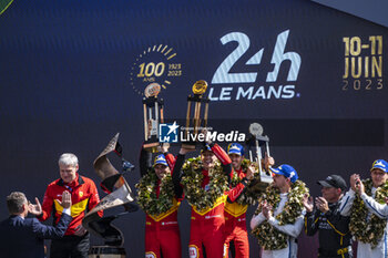 2023-06-11 - 51 PIER GUIDI Alessandro (ita), CALADO James (gbr), GIOVINAZZI Antonio (ita), Ferrari AF Corse, Ferrari 499P, portrait, podium with COLETTA Antonello during the podium of the 24 Hours of Le Mans 2023 on the Circuit des 24 Heures du Mans on June 11, 2023 in Le Mans, France - AUTO - LE MANS 2023 - PODIUM - ENDURANCE - MOTORS