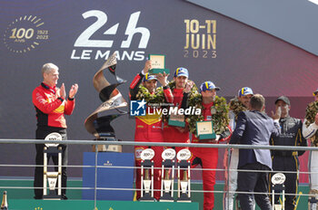 2023-06-11 - 51 PIER GUIDI Alessandro (ita), CALADO James (gbr), GIOVINAZZI Antonio (ita), Ferrari AF Corse, Ferrari 499P, celebrating victory with COLETTA Antonello during the podium of the 24 Hours of Le Mans 2023 on the Circuit des 24 Heures du Mans on June 11, 2023 in Le Mans, France - AUTO - LE MANS 2023 - PODIUM - ENDURANCE - MOTORS