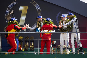 2023-06-11 - 51 PIER GUIDI Alessandro (ita), CALADO James (gbr), GIOVINAZZI Antonio (ita), Ferrari AF Corse, Ferrari 499P, win celebration with 02 BAMBER Earl (nzl), LYNN Alex (gbr), WESTBROOK Richard (gbr), Cadillac Racing, Cadillac V-Series.R during the podium of the 24 Hours of Le Mans 2023 on the Circuit des 24 Heures du Mans on June 11, 2023 in Le Mans, France - AUTO - LE MANS 2023 - PODIUM - ENDURANCE - MOTORS