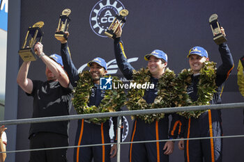 2023-06-11 - 25 AL HARTHT Ahmad (omn), DINAN Michael (usa), EASTWOOD Charlie (irl), ORT by TGG, Aston Martin Vantage AMR, portrait during the podium of the 24 Hours of Le Mans 2023 on the Circuit des 24 Heures du Mans on June 11, 2023 in Le Mans, France - AUTO - LE MANS 2023 - PODIUM - ENDURANCE - MOTORS