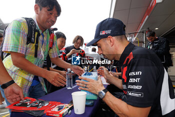 2023-09-09 - BUEMI Sébastien (swi), Toyota Gazoo Racing, Toyota GR010 - Hybrid, portrait Autograph session, ambiance, during the 6 Hours of Fuji 2023, 6th round of the 2023 FIA World Endurance Championship, from September 7 to 10, 2023 on the Fuji Speedway, in Oyama, Japan - AUTO - FIA WEC - 6 HOURS OF FUJI 2023 - ENDURANCE - MOTORS