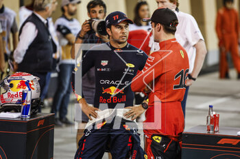 2023-03-04 - PEREZ Sergio (mex), Red Bull Racing RB19, portrait LECLERC Charles (mco), Scuderia Ferrari SF-23, portrait during the Formula 1 Gulf Air Bahrain Grand Prix 2023, 1st round of the 2023 FIA Formula One World Championship from March 2 to 5, 2023 on the Bahrain International Circuit, in Sakhir, Bahrain - F1 - BAHRAIN GRAND PRIX 2023 - FORMULA 1 - MOTORS